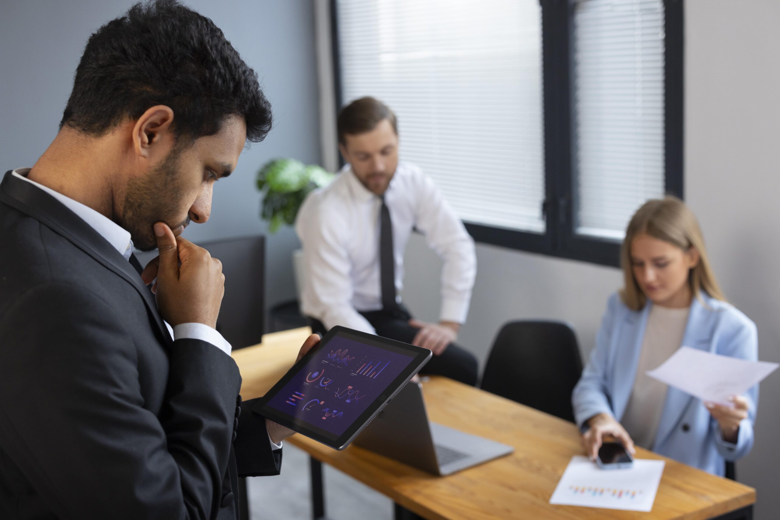 business-person-looking-finance-graphs-min